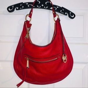 Vibrant bright RED authentic MK hobo style purse.